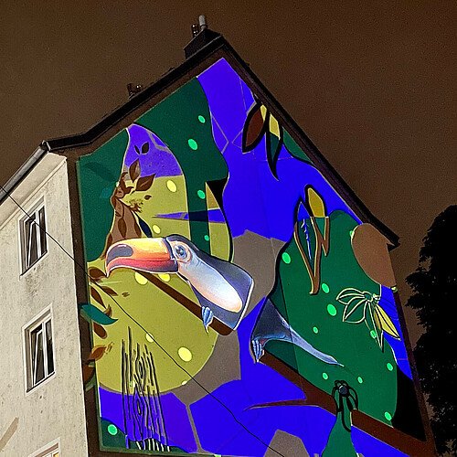Videoprojektion der Kölner Lichtkünstler Stulle & Peter erweckt Wandbild in Kalk zum Leben